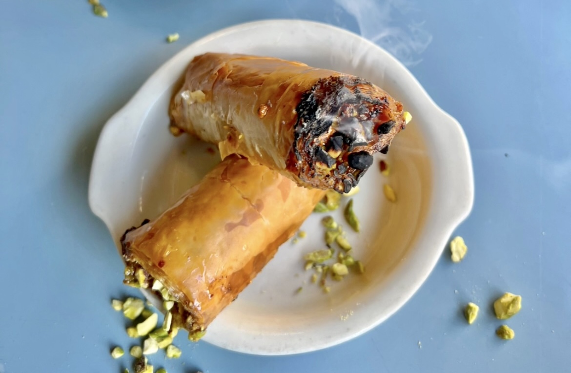 blue table with smoking baklava blunts